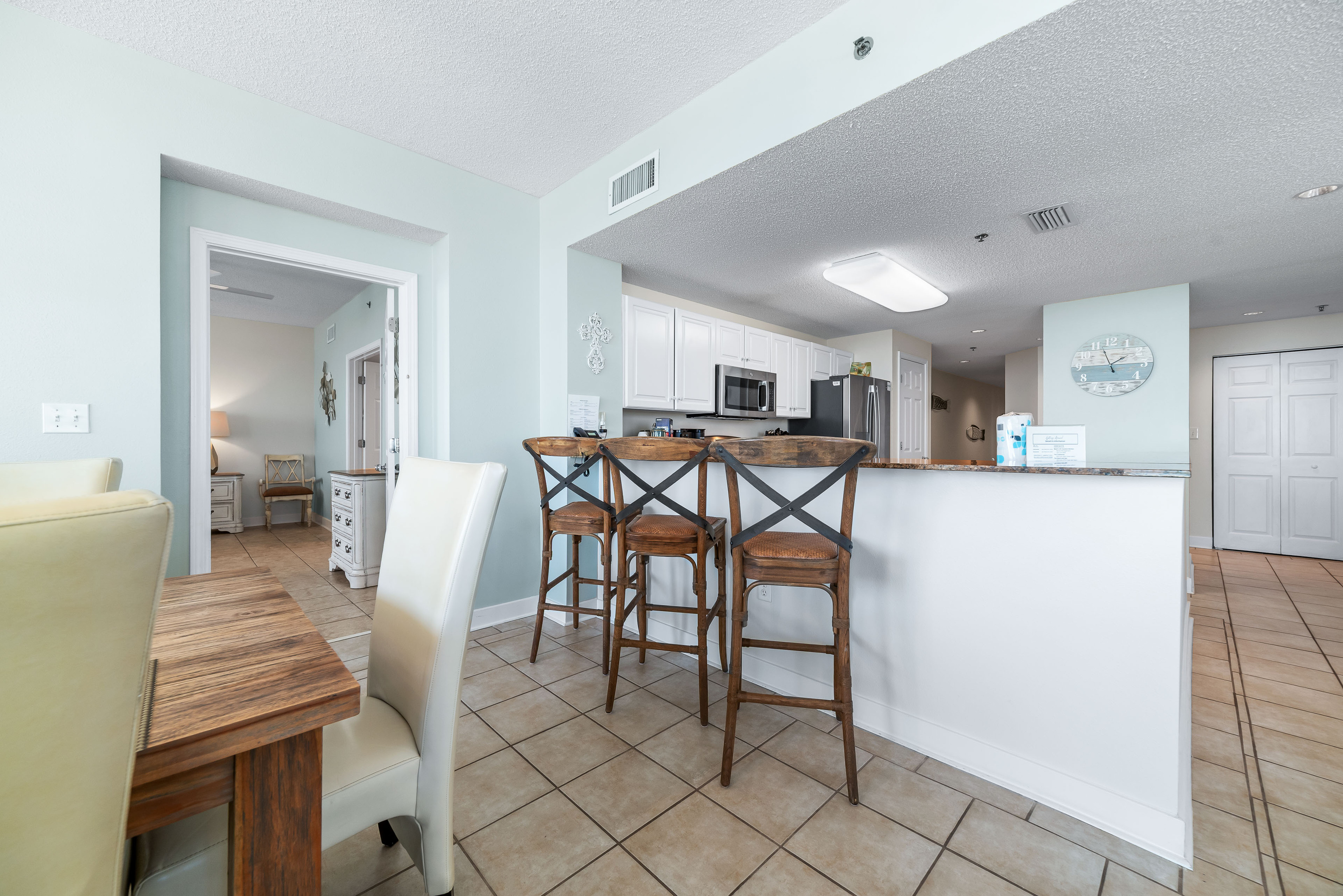 Experience the convenience of this open-concept kitchen, complete with a breakfast bar, modern appliances, and a welcoming atmosphere.