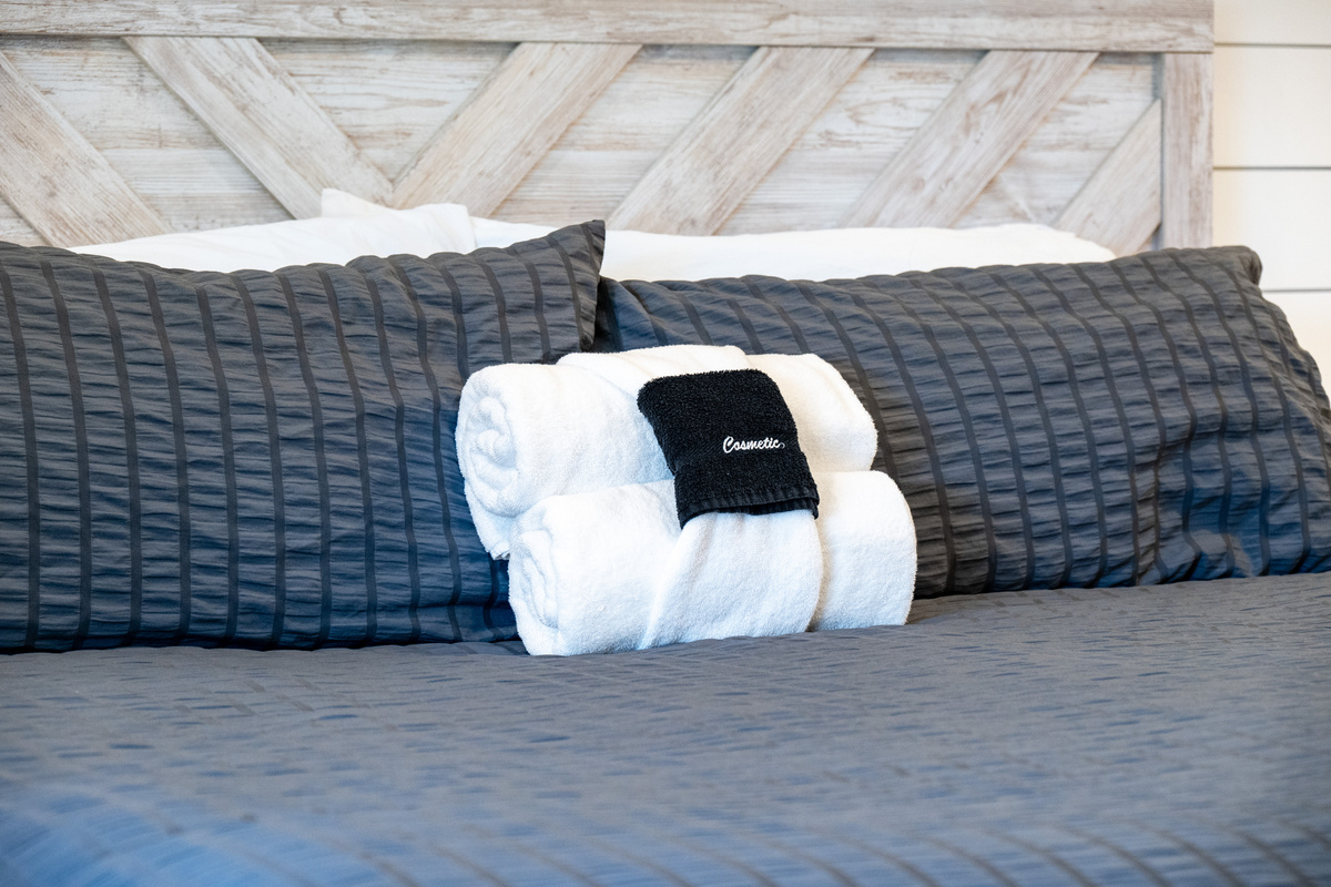 Plush King bed with premium linens in the primary suite.