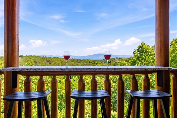 Private deck bar with a breathtaking Mount LeConte view, made for sunrise coffee, evening wine, and quiet mountain memories.