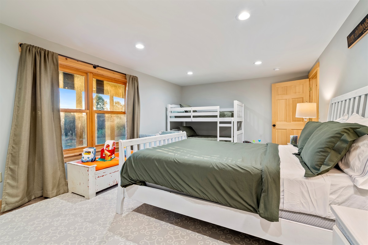 Spacious basement bedroom with room for everyone.