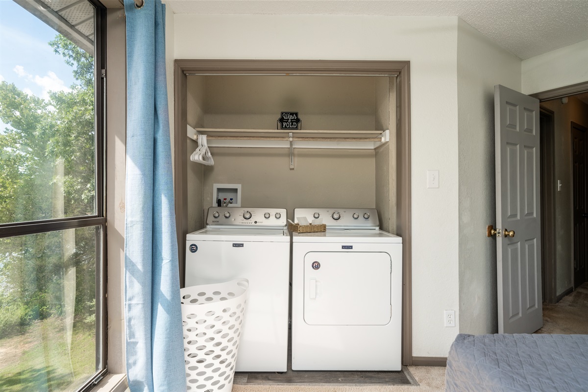 Laundry closet in the lake facing bedroom