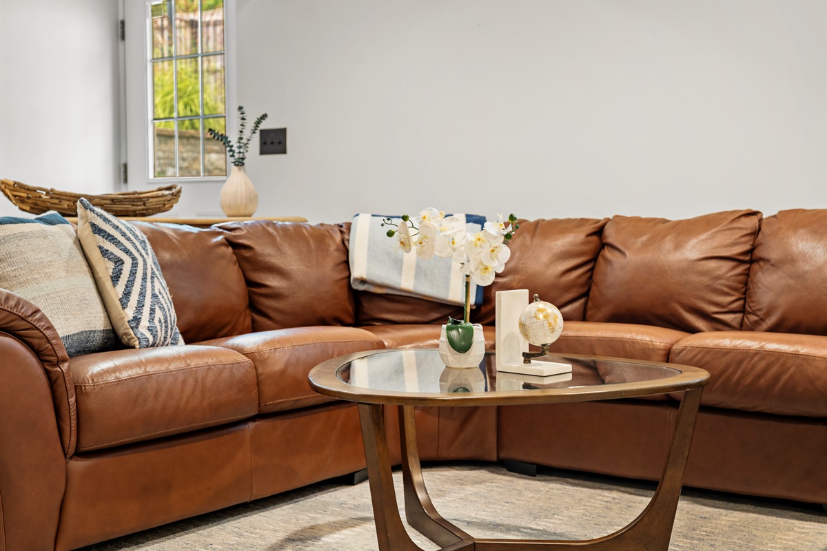 Step into our cozy basement lounge, where comfort and fun meet.