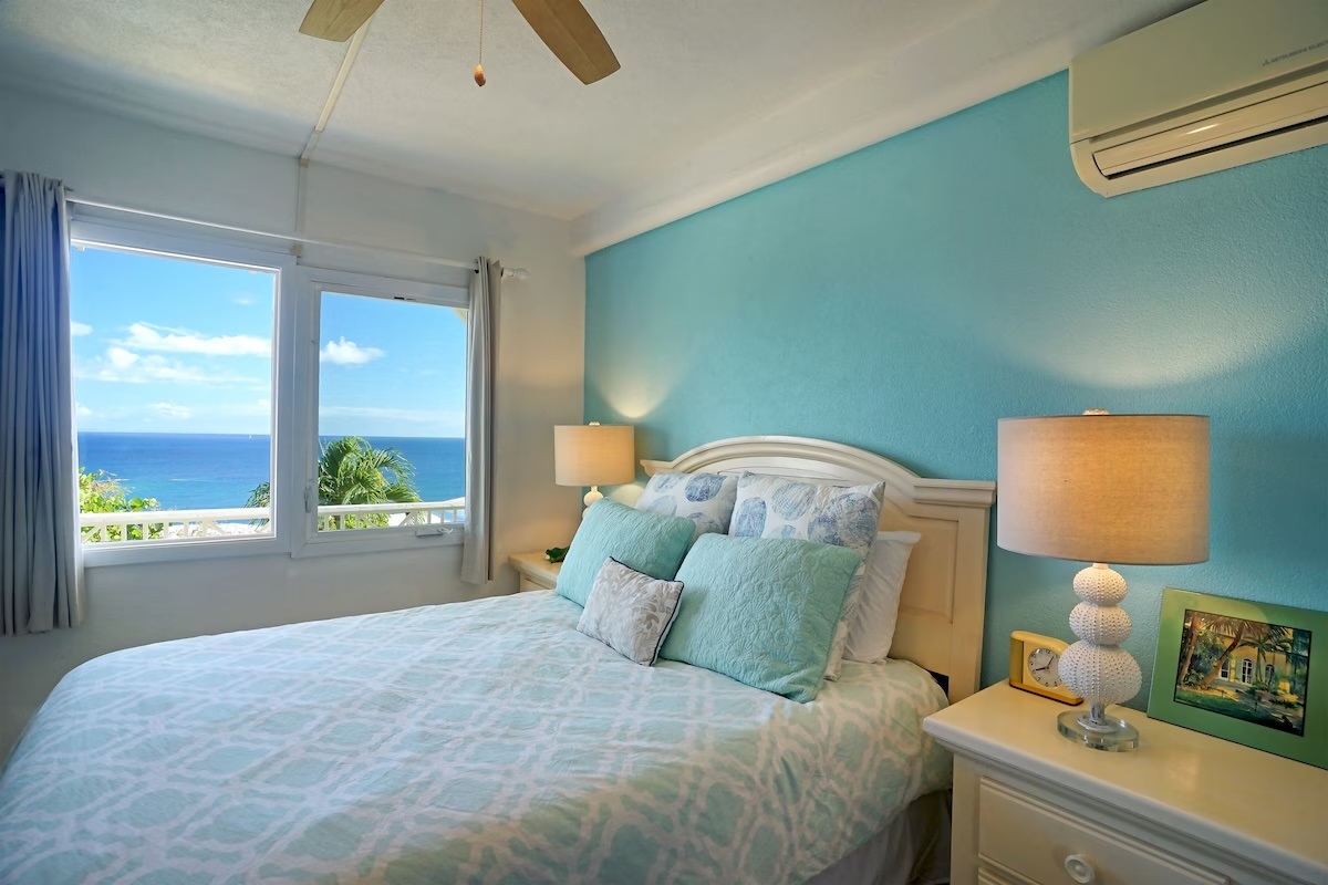 Cruzan room with Queen bed, ceiling fan, AC and ensuite bathroom