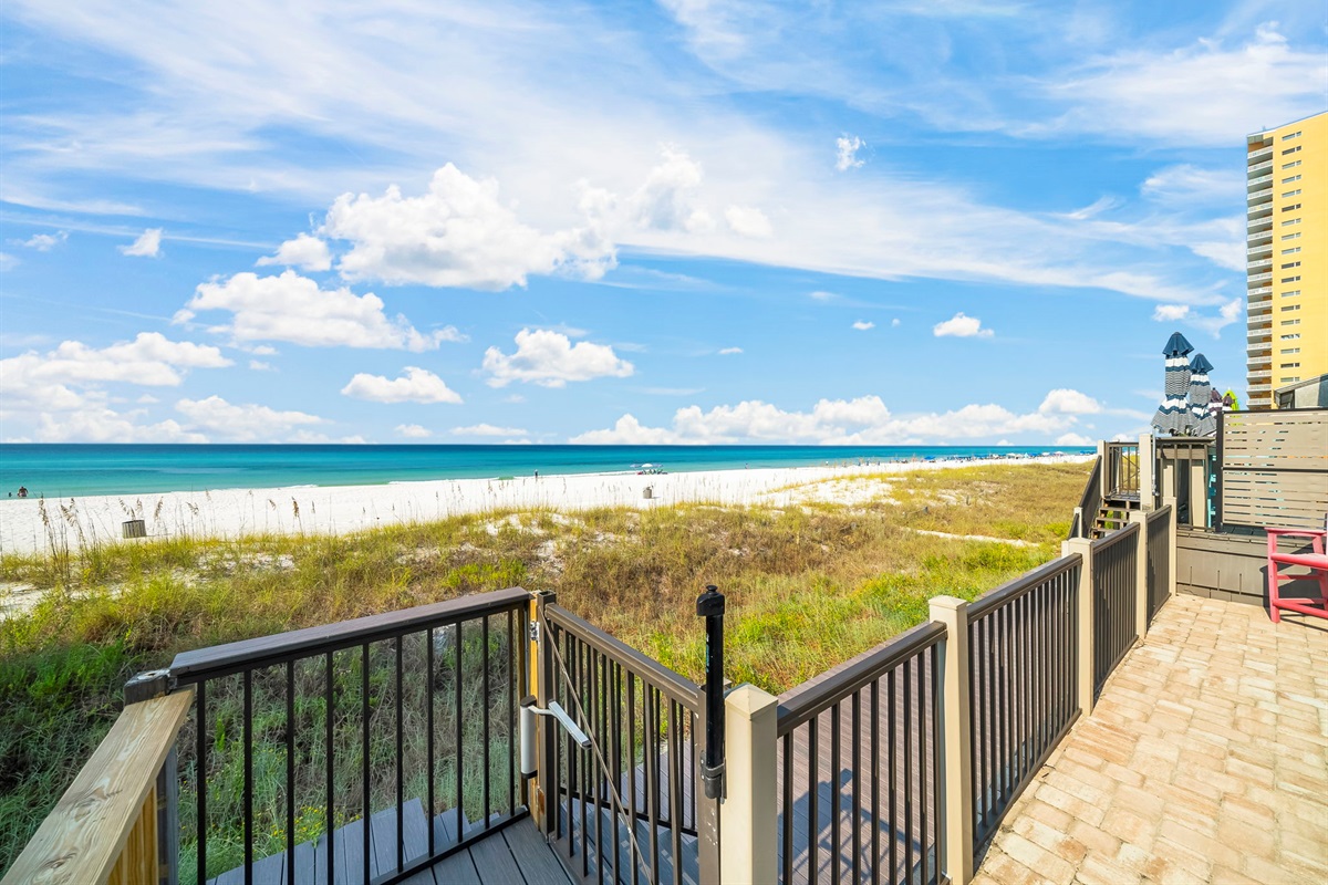 Swim, sun, or stroll: enjoy the shared beachfront pool, sundeck, outdoor shower, and private boardwalk to the sand — plus a shared grill for those perfect cookout nights.