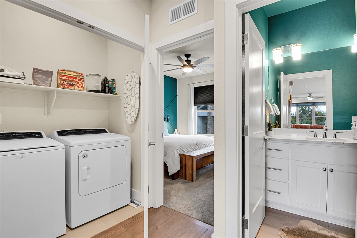 Laundry area and upstairs half bathroom