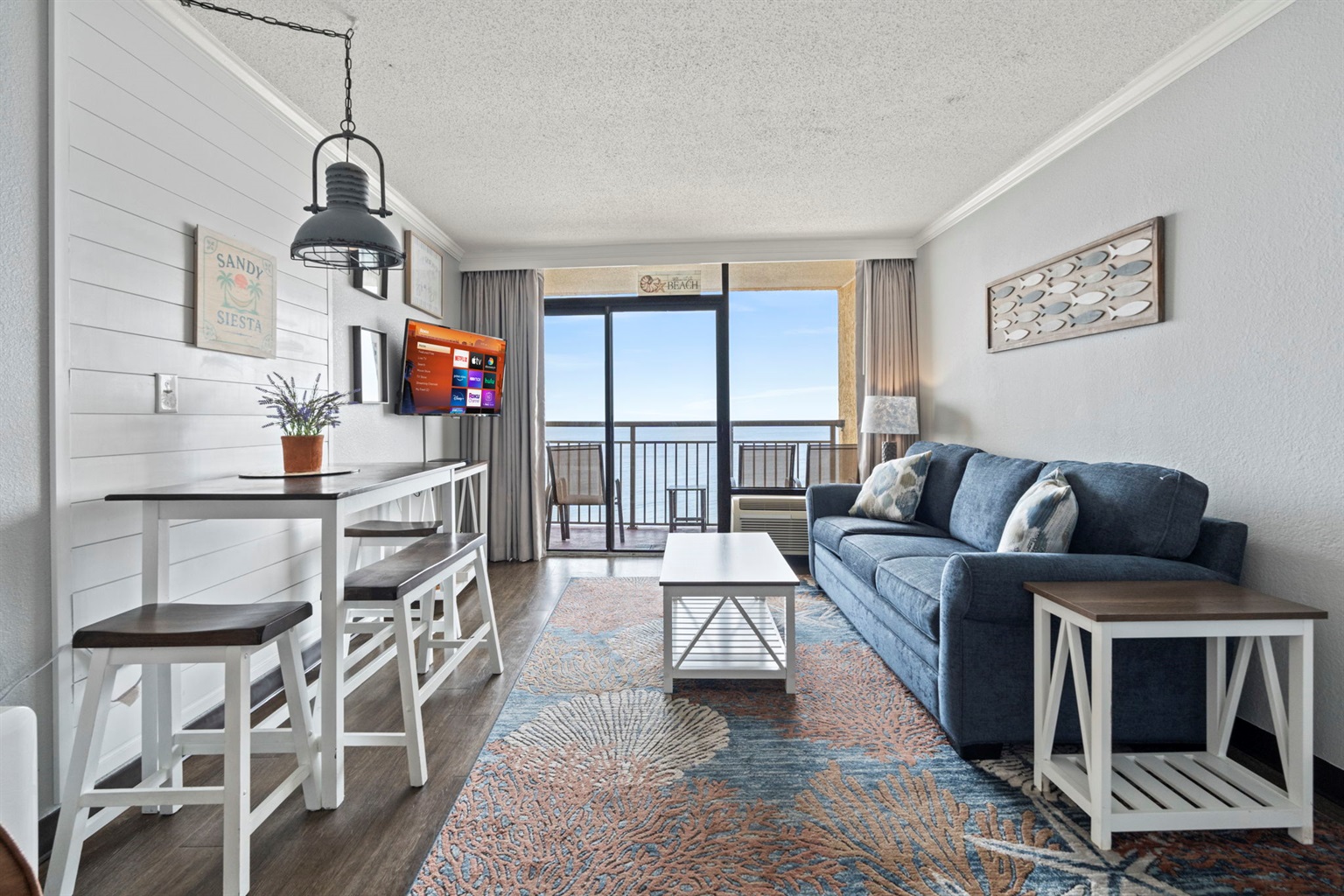 Enjoy ocean views from the living room, Smart TV enabled