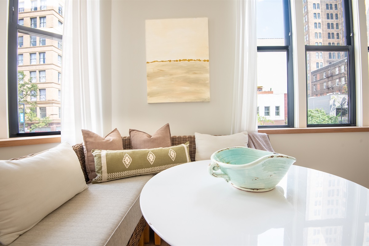 Dining nook with elegant seating and city views
