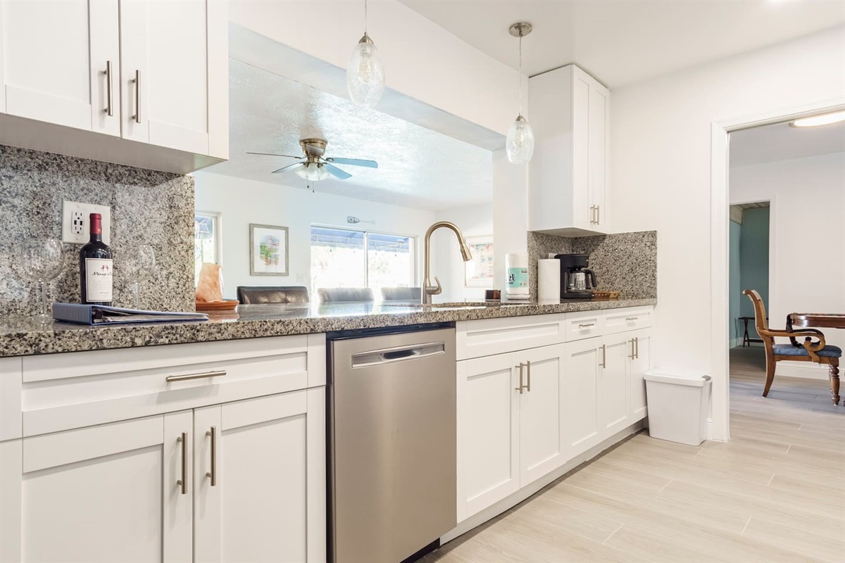 View from kitchen looking toward dinning and Florida room.The open design and amenitiesof this home foster inclusion, conversation, family time together. Pour a glass of wine, playa game of pool, enjoy some hors doeuvres, mix and mingle!