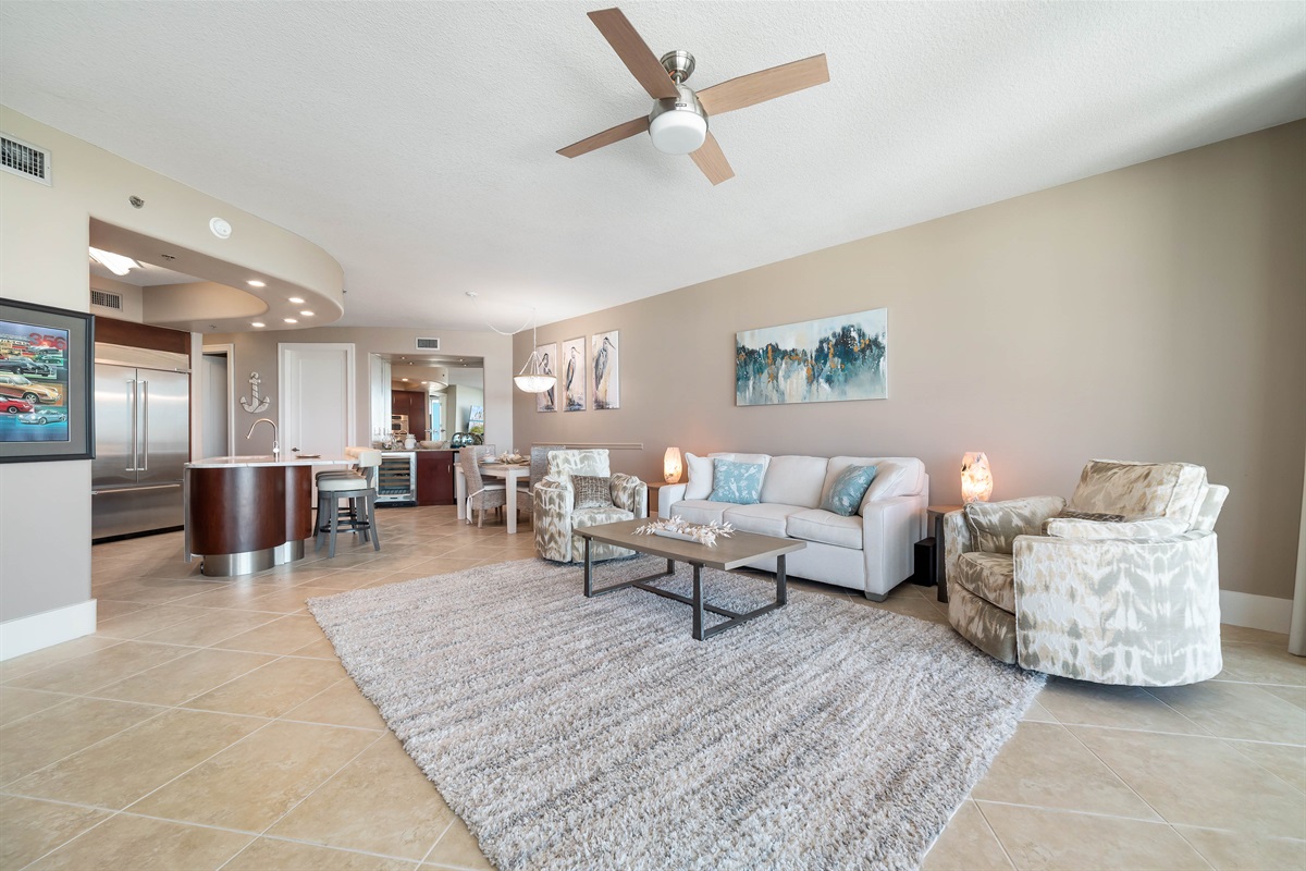 This thoughtfully designed living space maximizes natural light and integrates seamlessly with the surrounding environment. The open-concept layout and expansive windows create a bright and airy atmosphere.