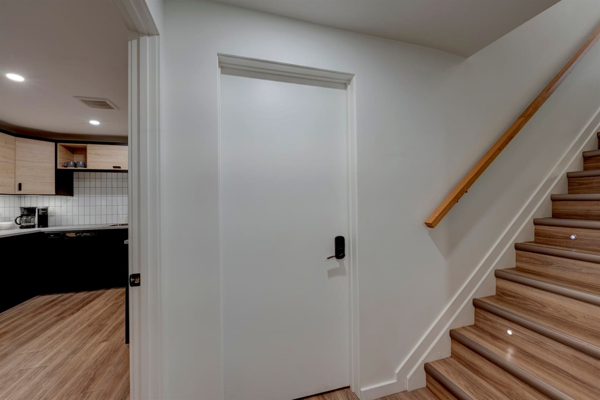View of the suite entry at the bottom of the stairs.