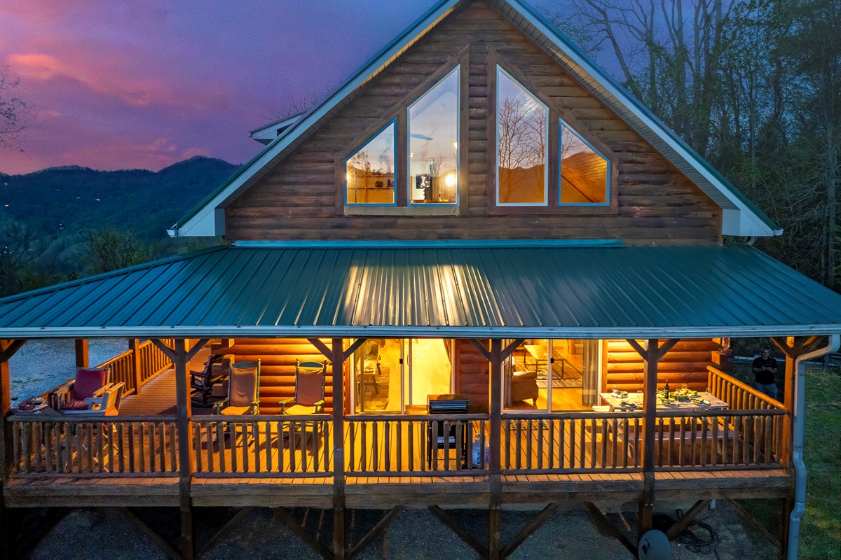 Exterior Escape: Embrace breathtaking mountain views from this charming log cabin porch!

