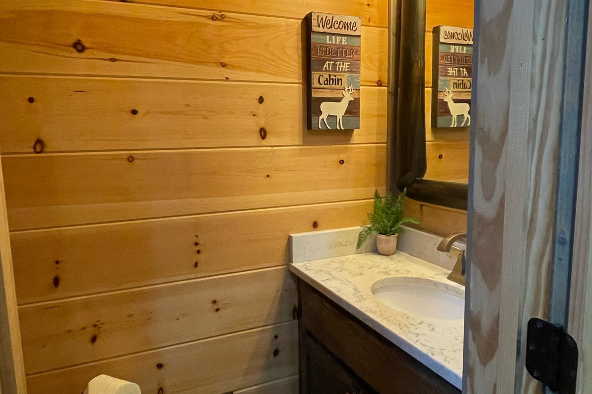 Downstairs 1/2 bath conveniently located for all guests.