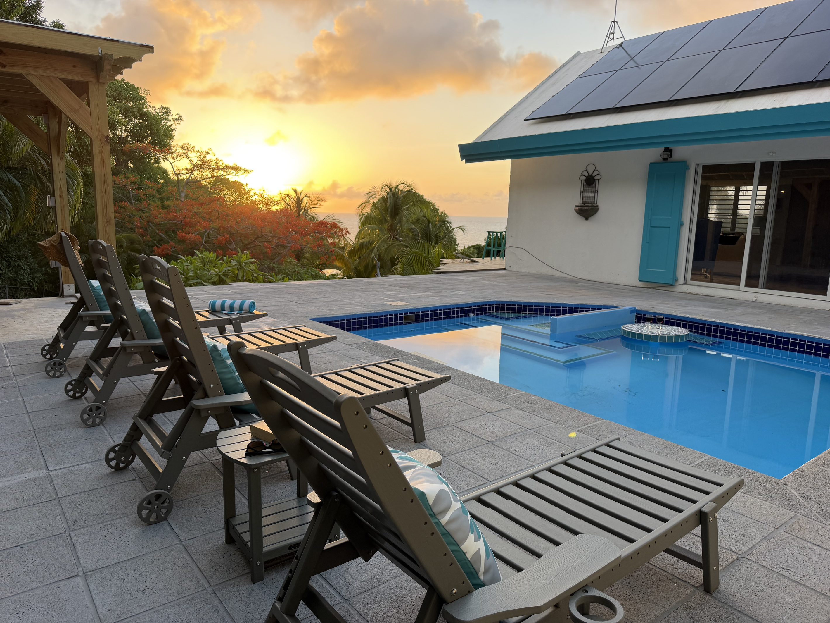 Watch the sky transform into gold and violet right from your private pool deck. Designed to capture St. Croix's breathtaking sunsets, this outdoor space offers unbeatable views over lush tropical gardens toward the Caribbean Sea.