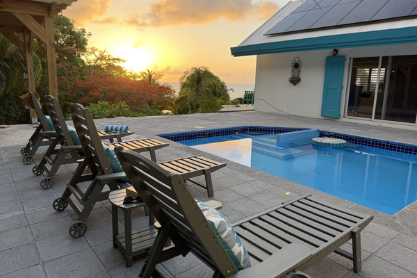 Watch the sky transform into gold and violet right from your private pool deck. Designed to capture St. Croix's breathtaking sunsets, this outdoor space offers unbeatable views over lush tropical gardens toward the Caribbean Sea.