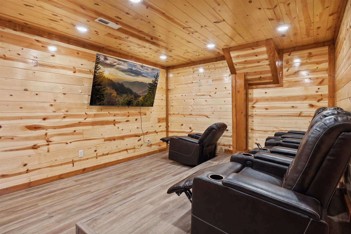 Private theater room with reclining cinema-style seating
