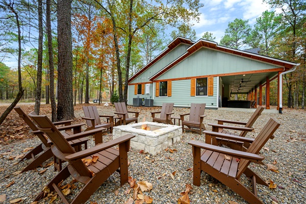 Spacious outdoor fire pit with Adirondack seating—perfect for s’mores, stargazing, and cozy nights in the Broken Bow woods. 🌲🔥