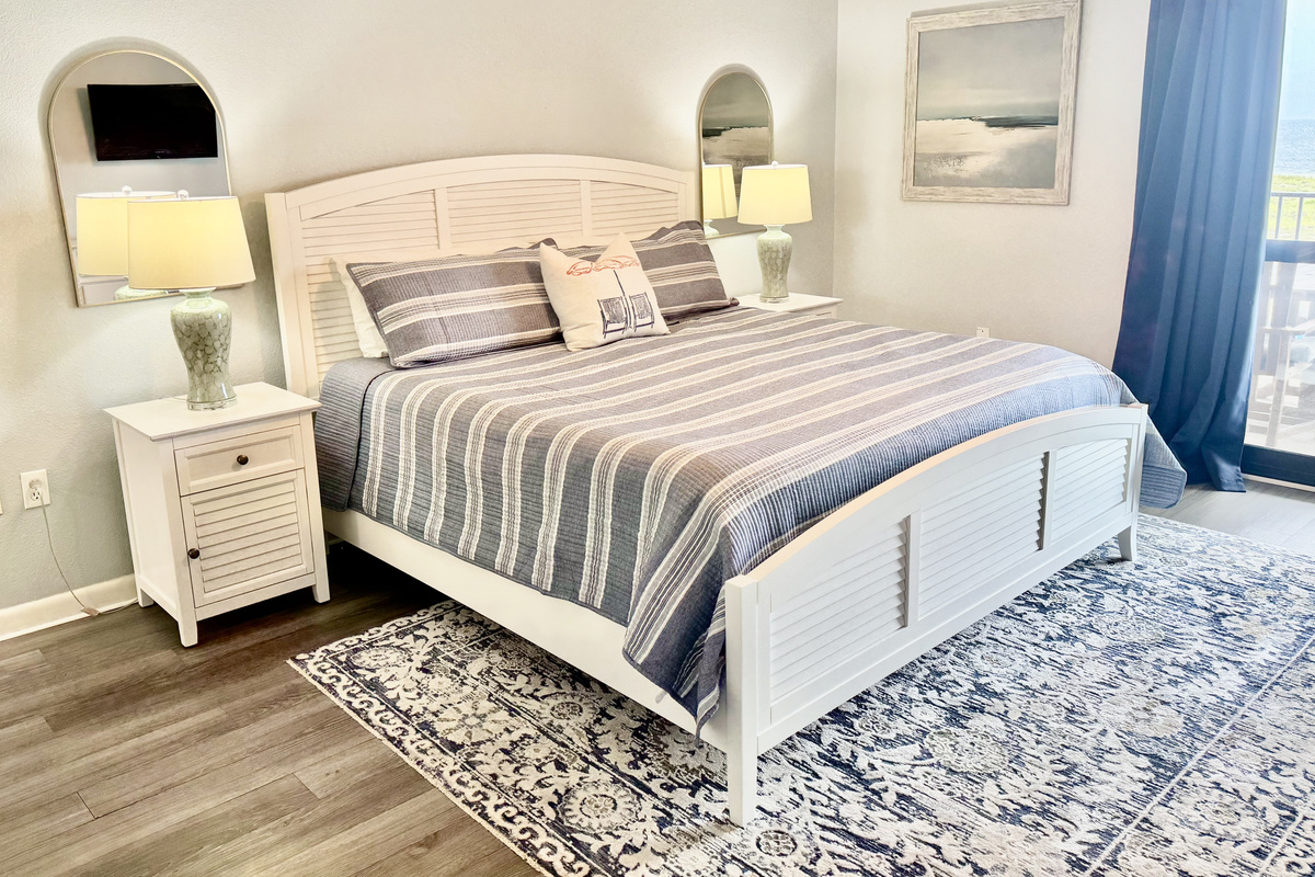 The master has a king-sized bed for ultimate relaxation!  And, there is an entrance to the gulf-front balcony from this room!