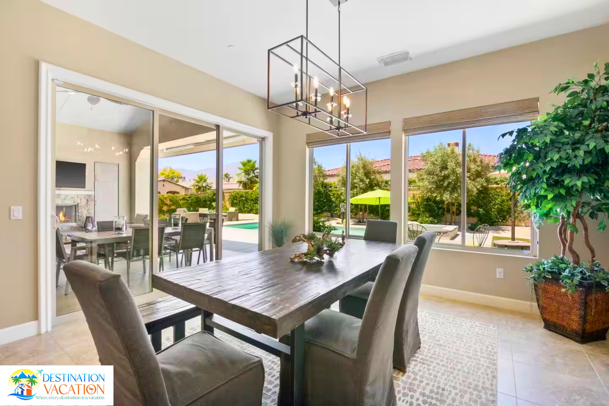 Sunlit dining area opens beautifully to breathtaking outdoor views.