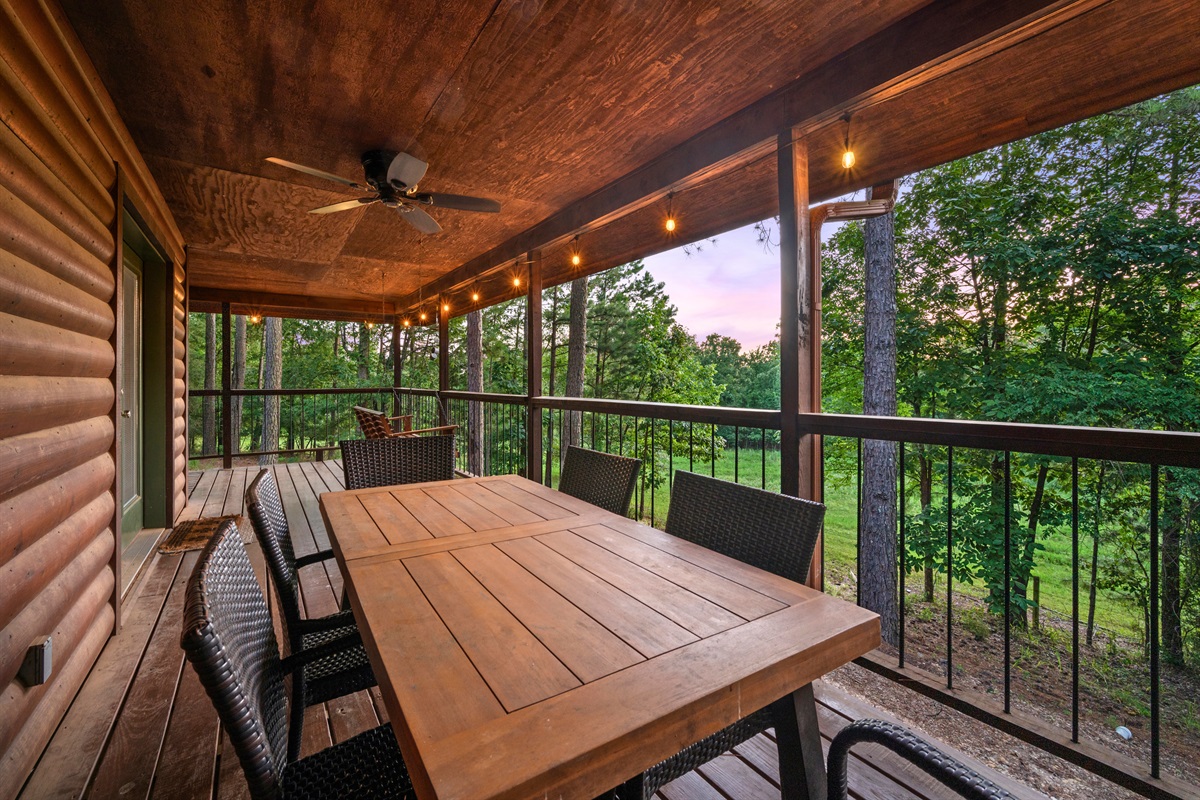 Spacious covered dining area with seating for 6 — ideal for alfresco meals and game nights.