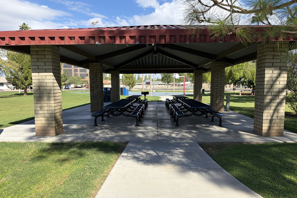 Covered picnic tables at Hollis park (right next door)