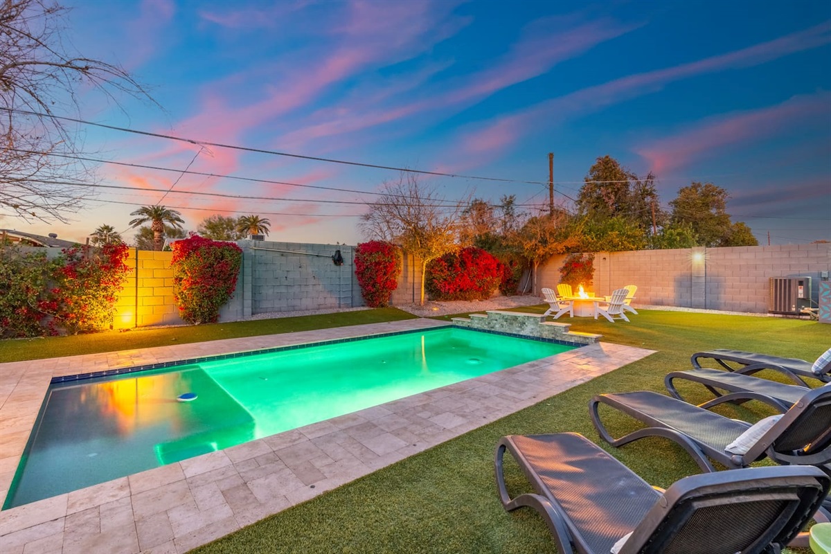 Inviting pool with vibrant lights and an open-air setting, creating a relaxing ambiance for evening swims and outdoor enjoyment.