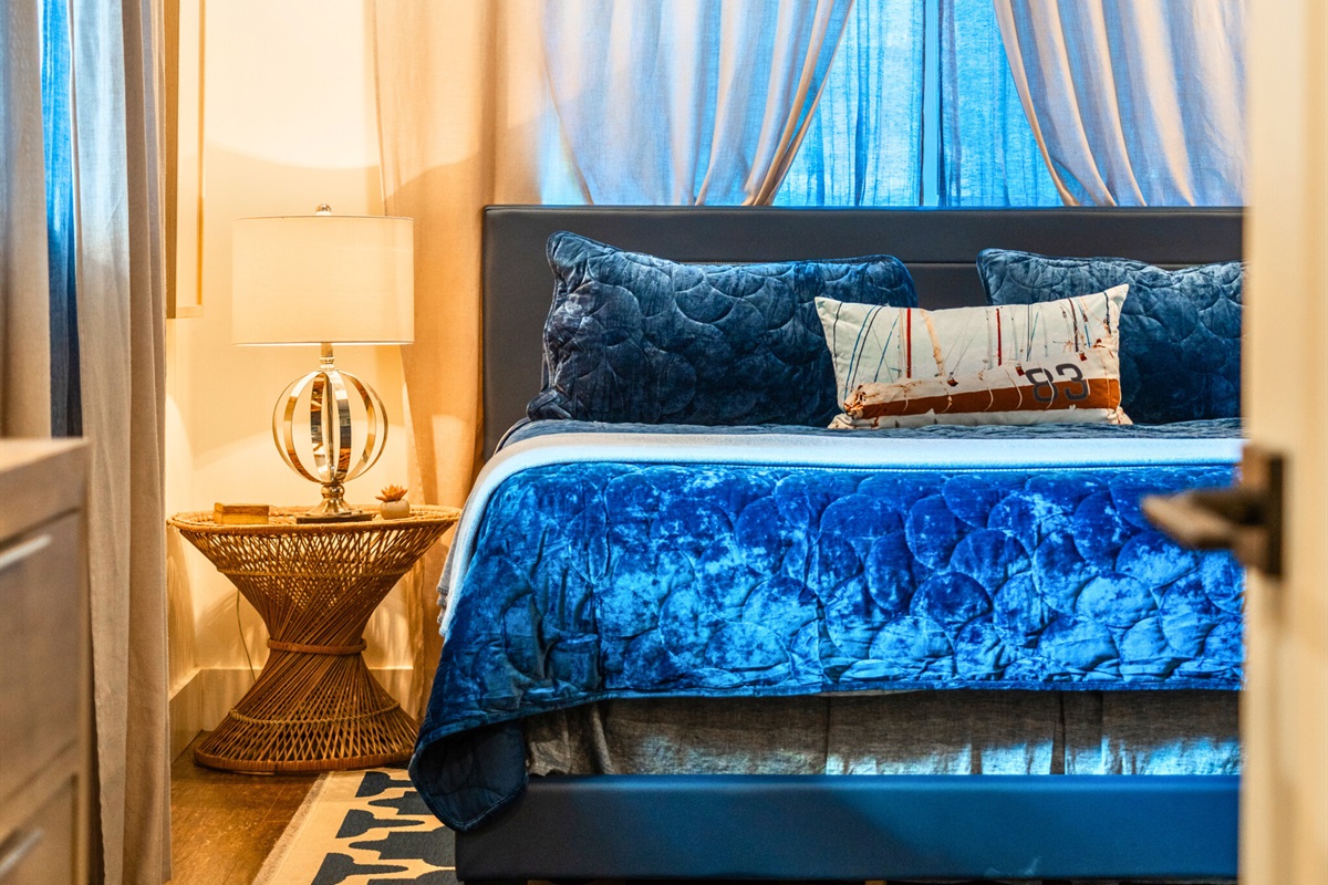 Elegant bedroom corner with plush bedding and warm lighting for total comfort.