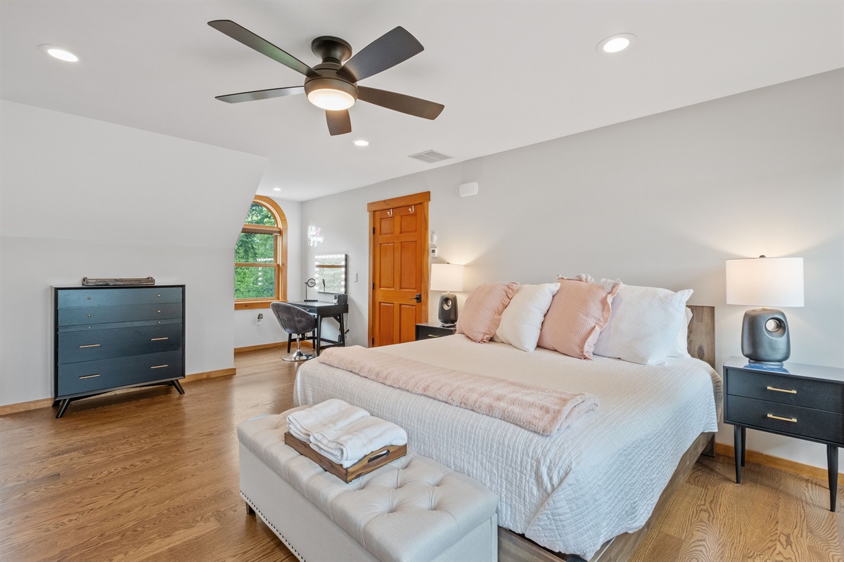 Second floor guest bedroom with king and two queen beds, the bath for this bedroom is a few steps down the hall