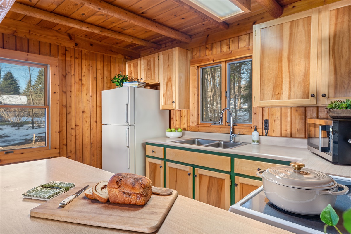 Fully stocked kitchen with coffee, tea, cookware & everything you need for easy meals.