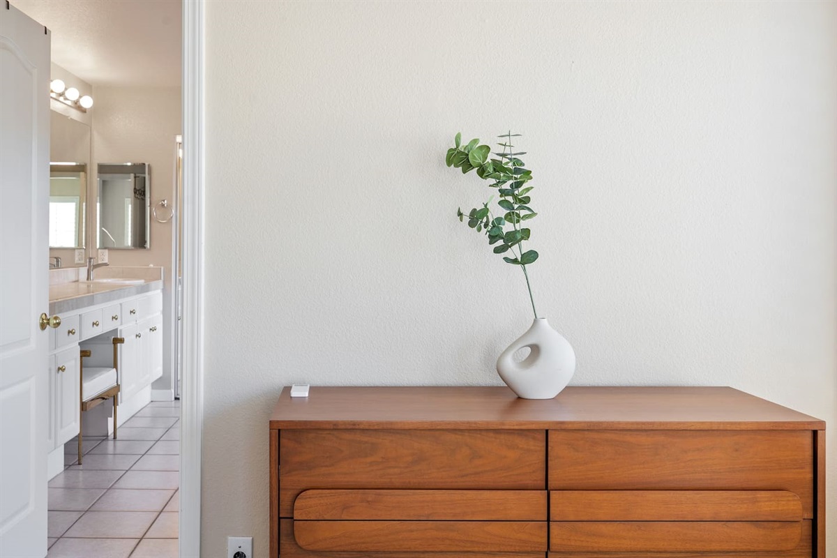 Side wooden table drawer  with a beautiful vase of plant