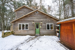 Parking area an entrance to the house during winter