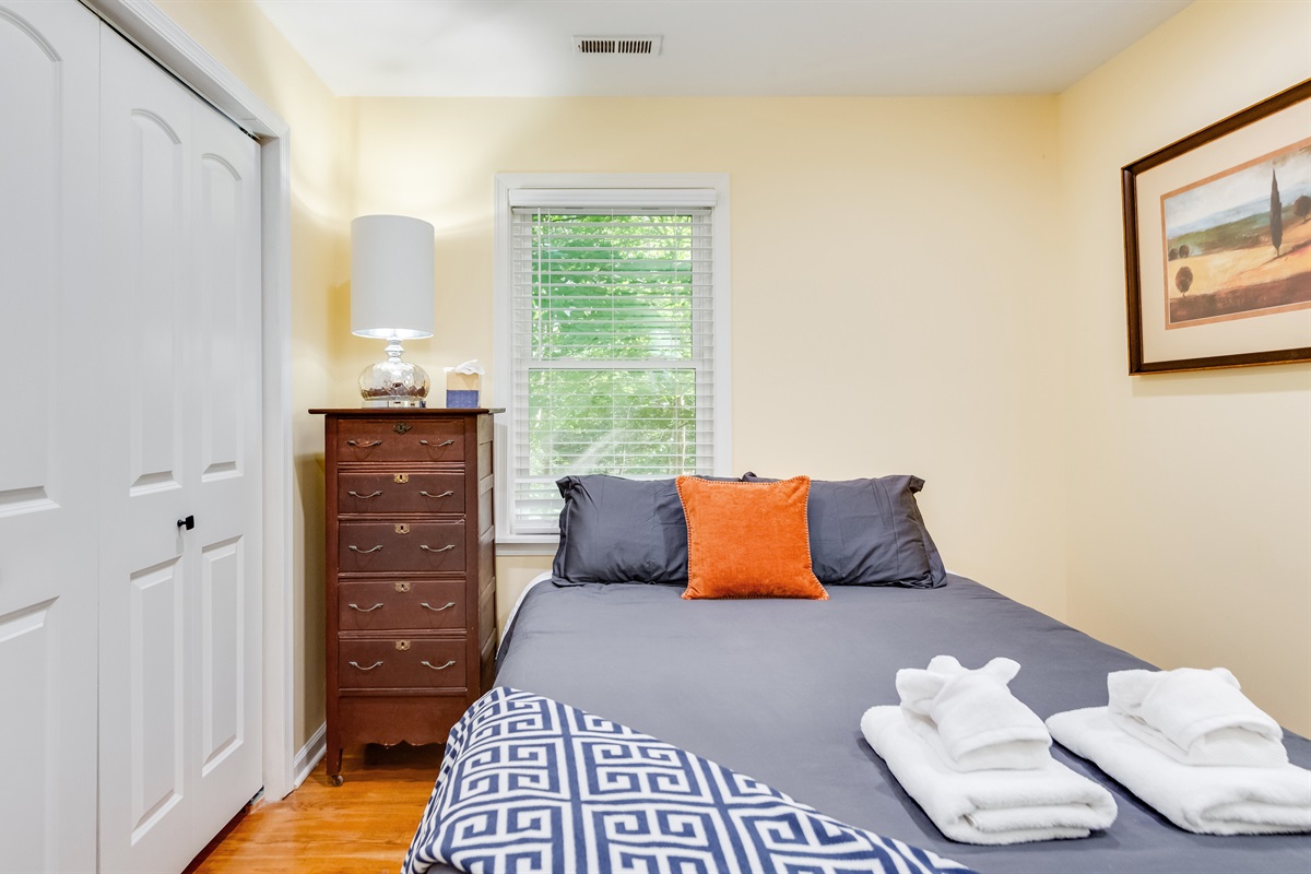 Upstairs Queen Bedroom 1: Bright and inviting escape with vintage charm and modern comfort awaits!