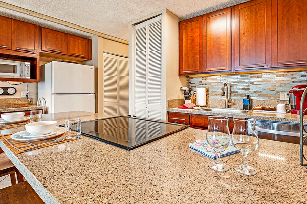 Open concept kitchen with quartz countertops.