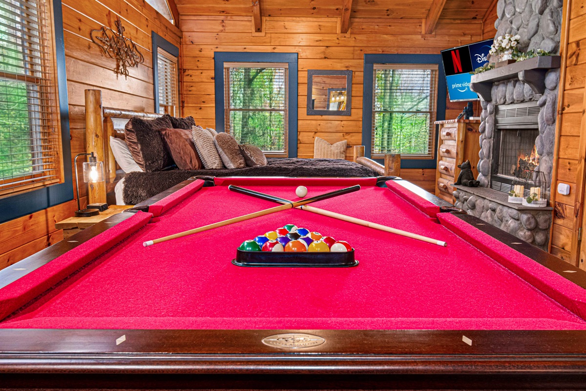 Love is patient, love is kind… unless you’re stripes and I’m solids. Enjoy a game of pool in this massive en-suite king bedroom. Two TV's to enjoy while playing your best game