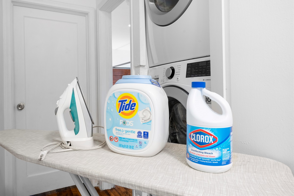 Laundry and supplies located in the hallway upstairs.