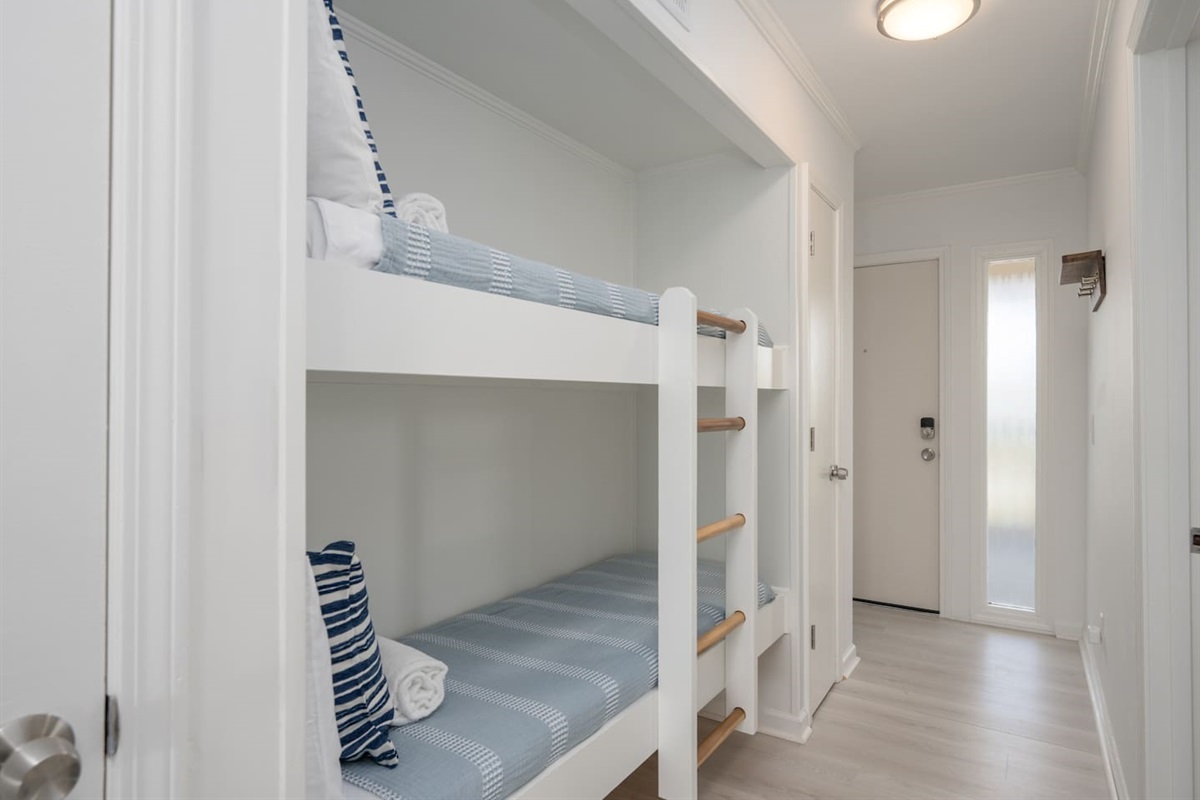 Twin bunk beds located in the entryway.