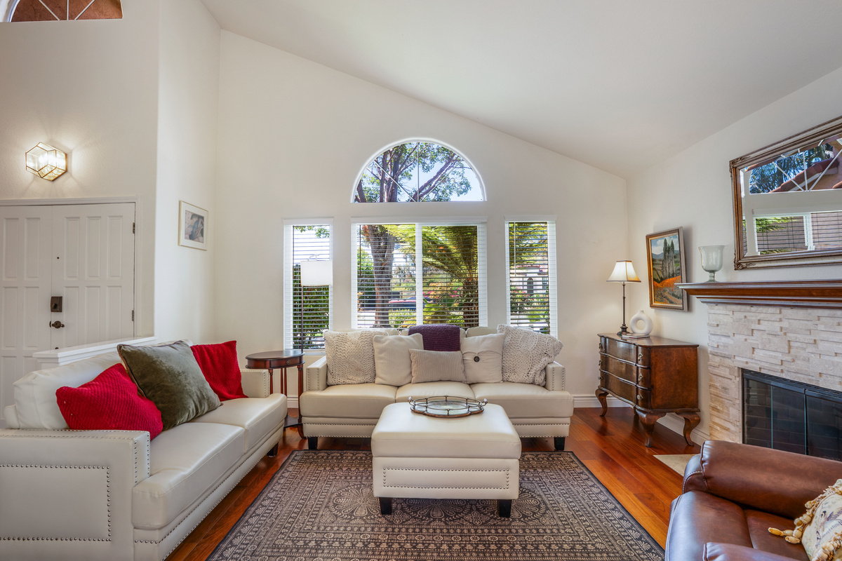 Welcoming Living Room with Fireplace, Two Sofas, Massage Recliner
