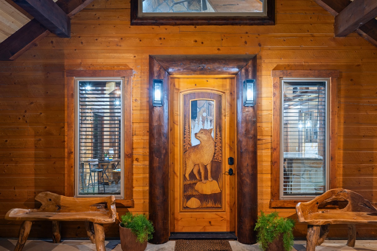 Inviting front entry with rustic wood finishes and warm lighting.