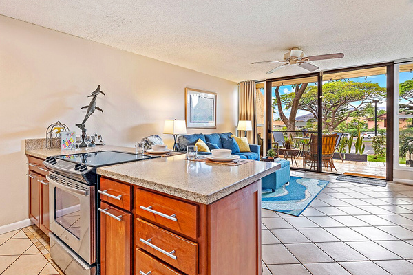 Open concept kitchen with full appliances.