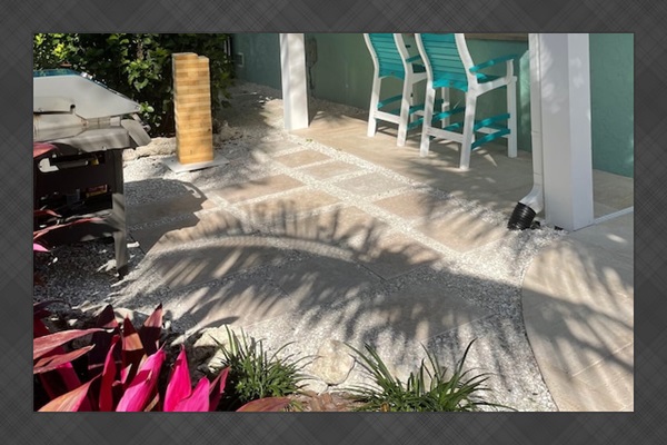 Grill Station with backup propane tank and ample outdoor seating