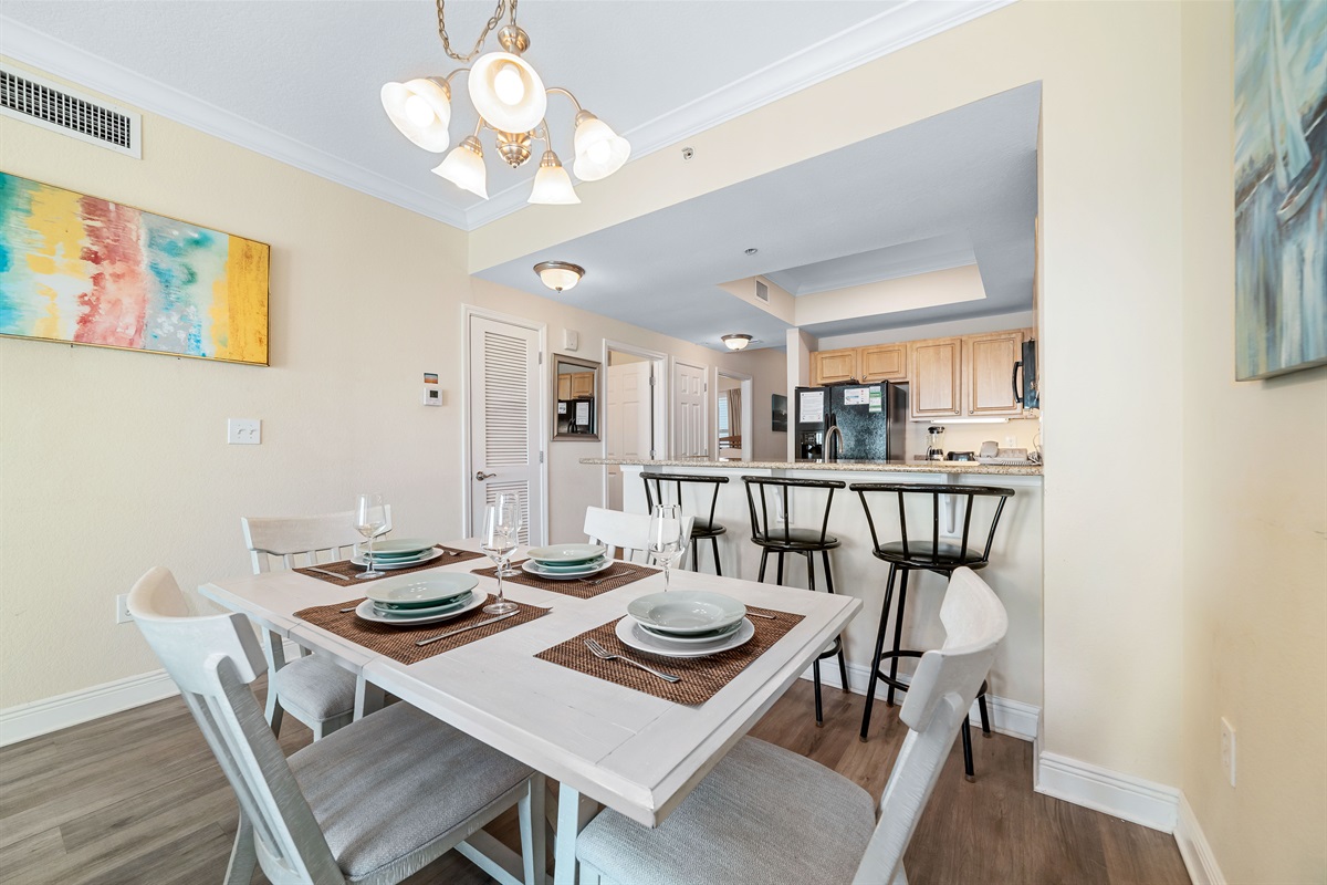 Flexible dining options for every occasion. Enjoy a formal meal at the dining table or a casual snack at the breakfast bar, seamlessly connected to the fully equipped kitchen.