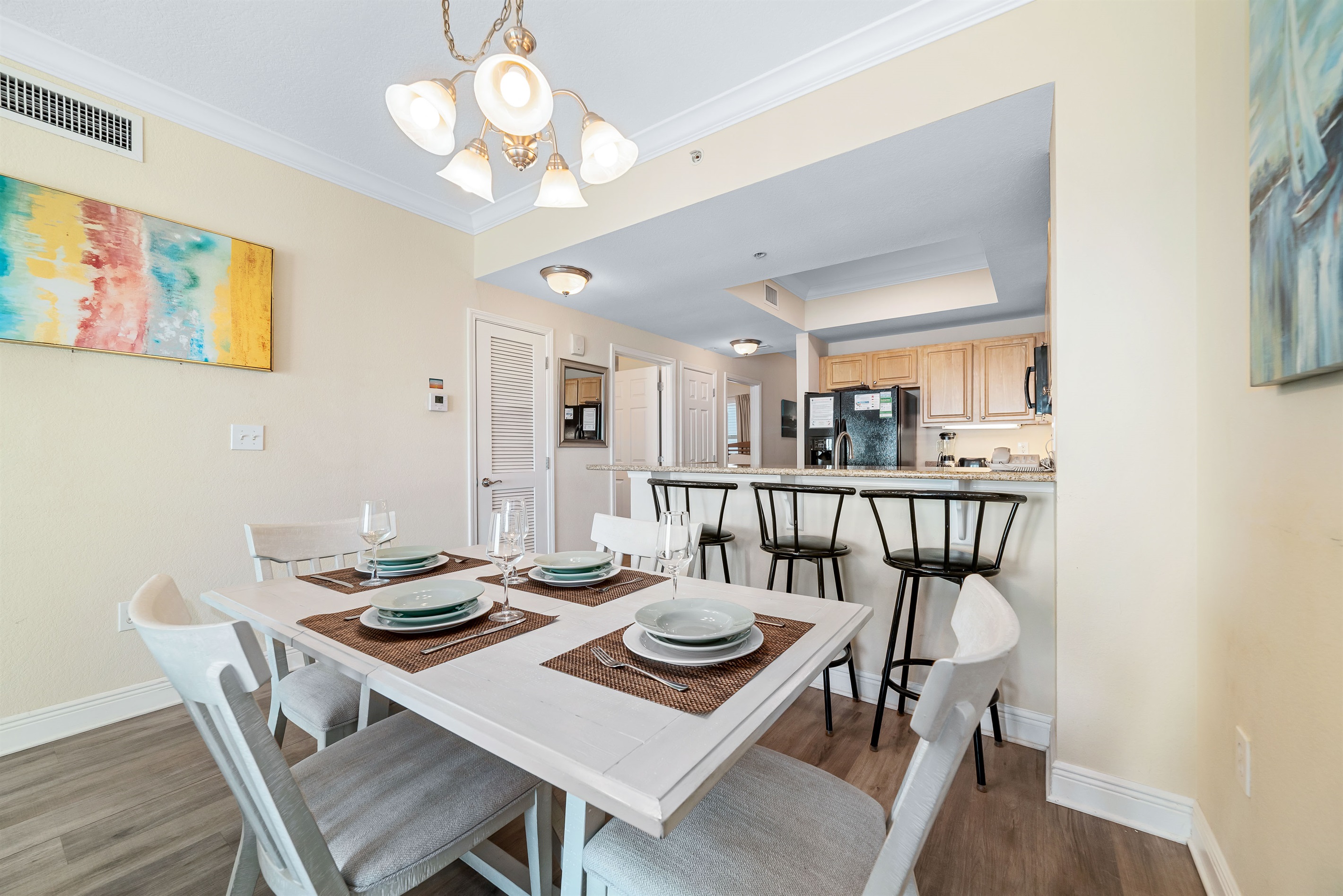 Flexible dining options for every occasion. Enjoy a formal meal at the dining table or a casual snack at the breakfast bar, seamlessly connected to the fully equipped kitchen.