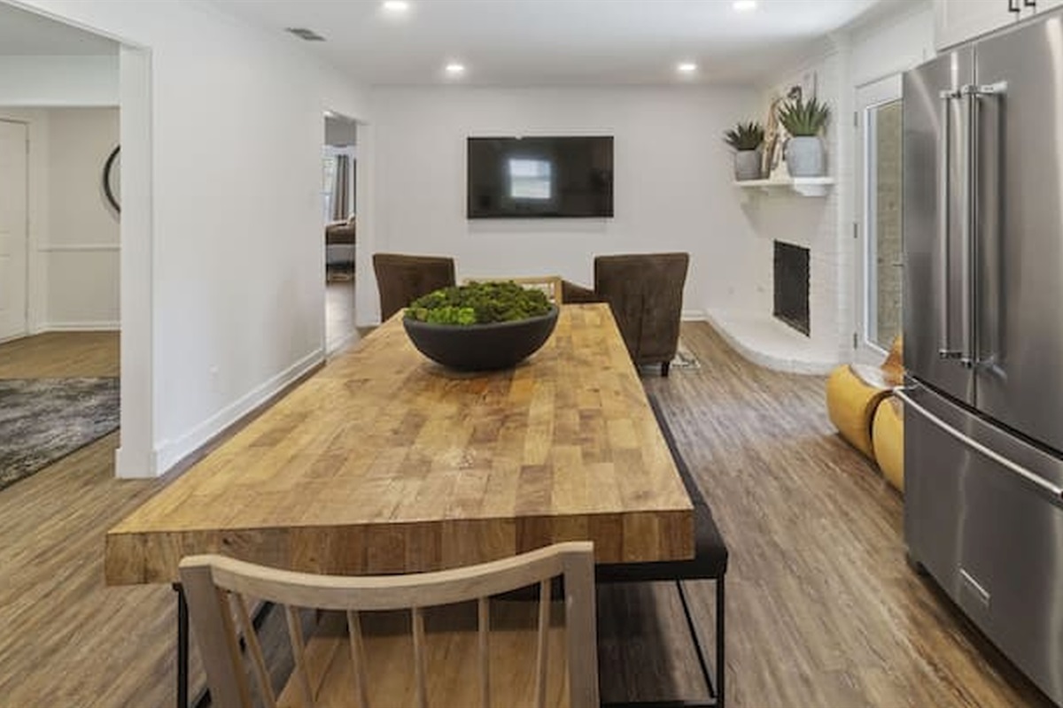 Bright open-concept layout connecting the kitchen, dining, and living spaces seamlessly.