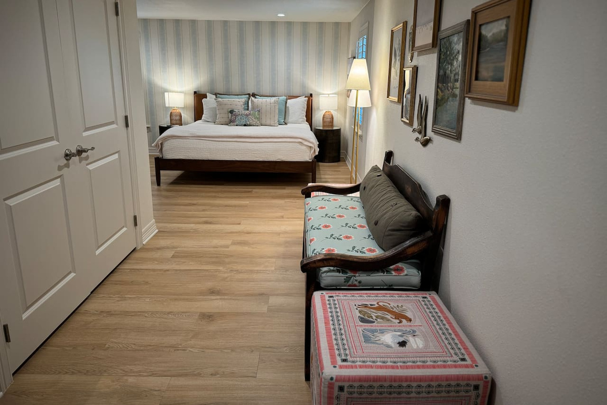 downstairs primary bedroom with king bed