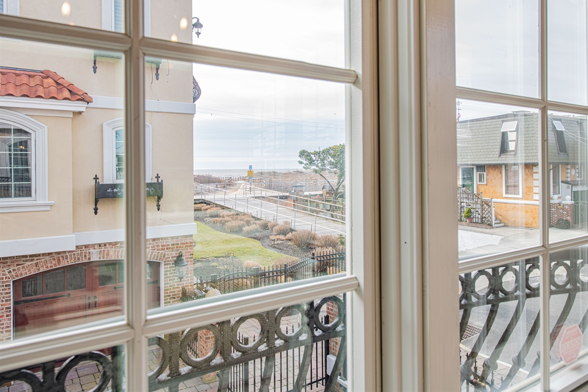 view of boardwalk and beach entrance