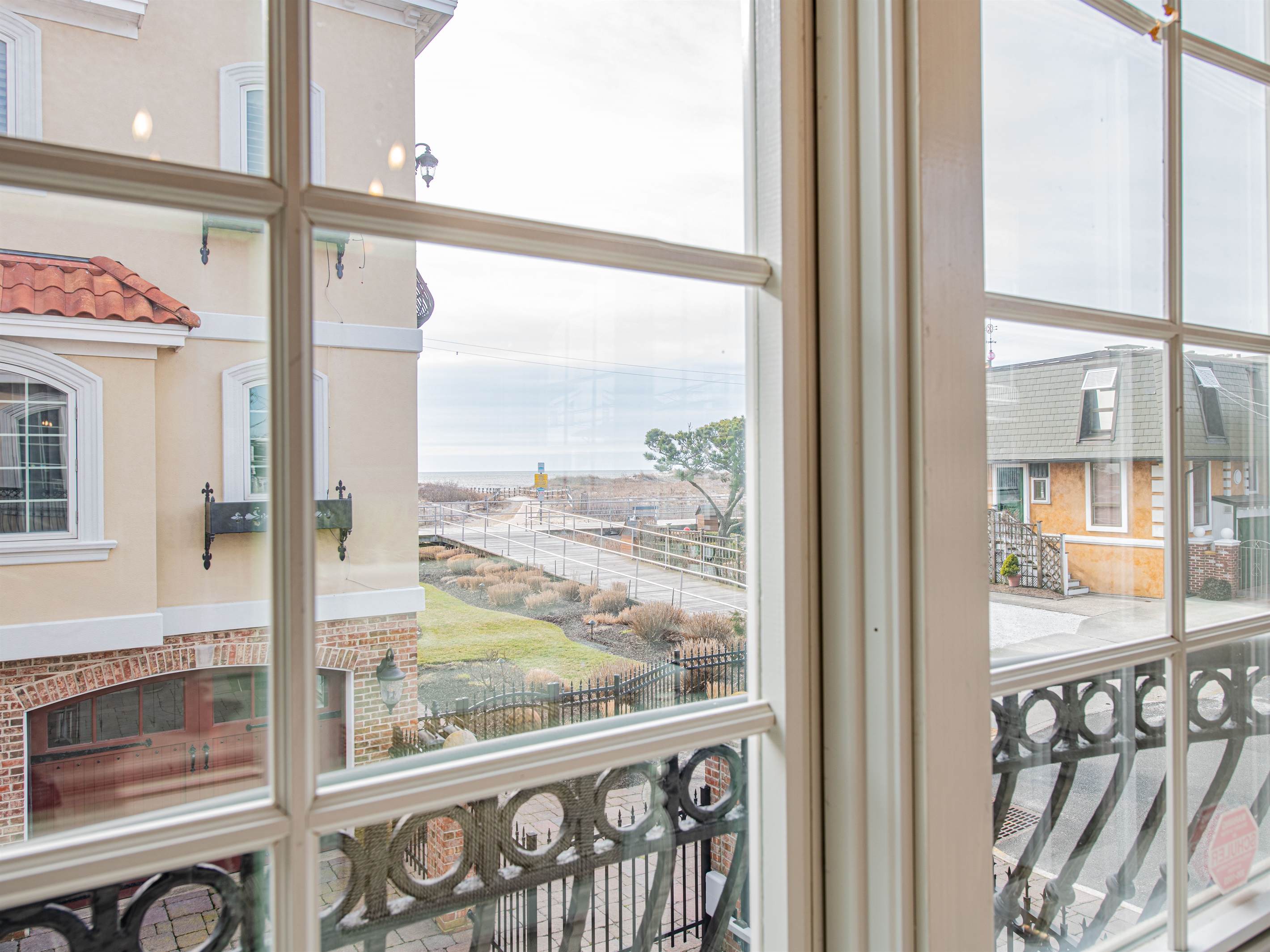 view of boardwalk and beach entrance