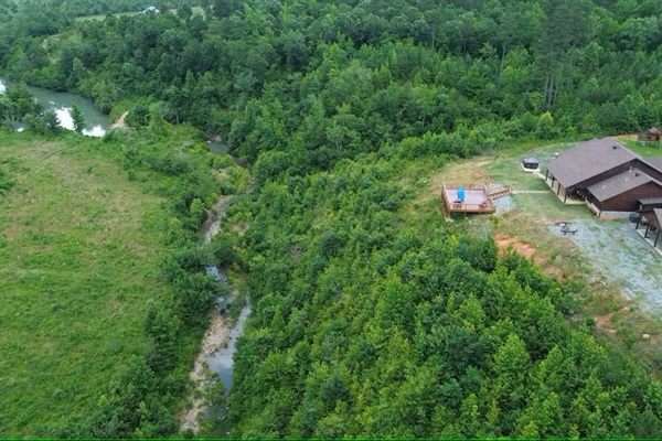 Aerial view highlighting the Little River flowing through the property.