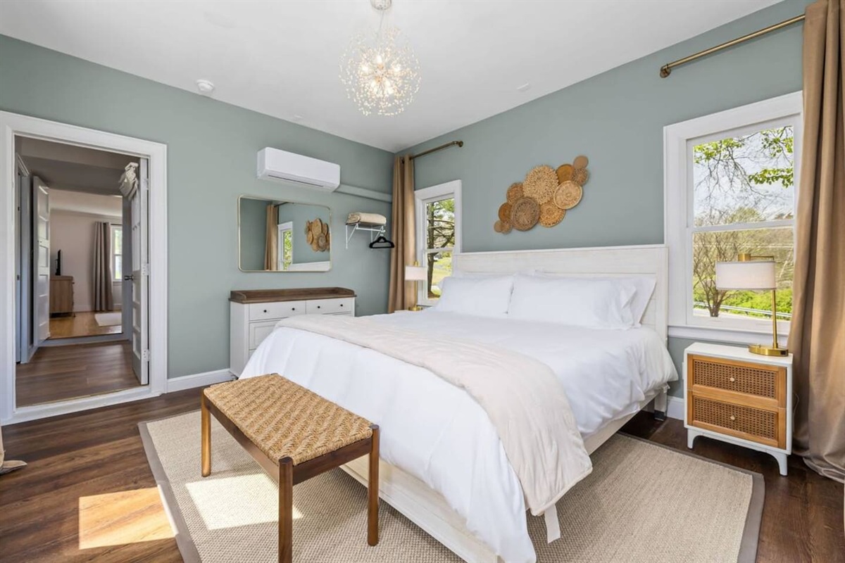 The bathroom is located between the 2 bedrooms.