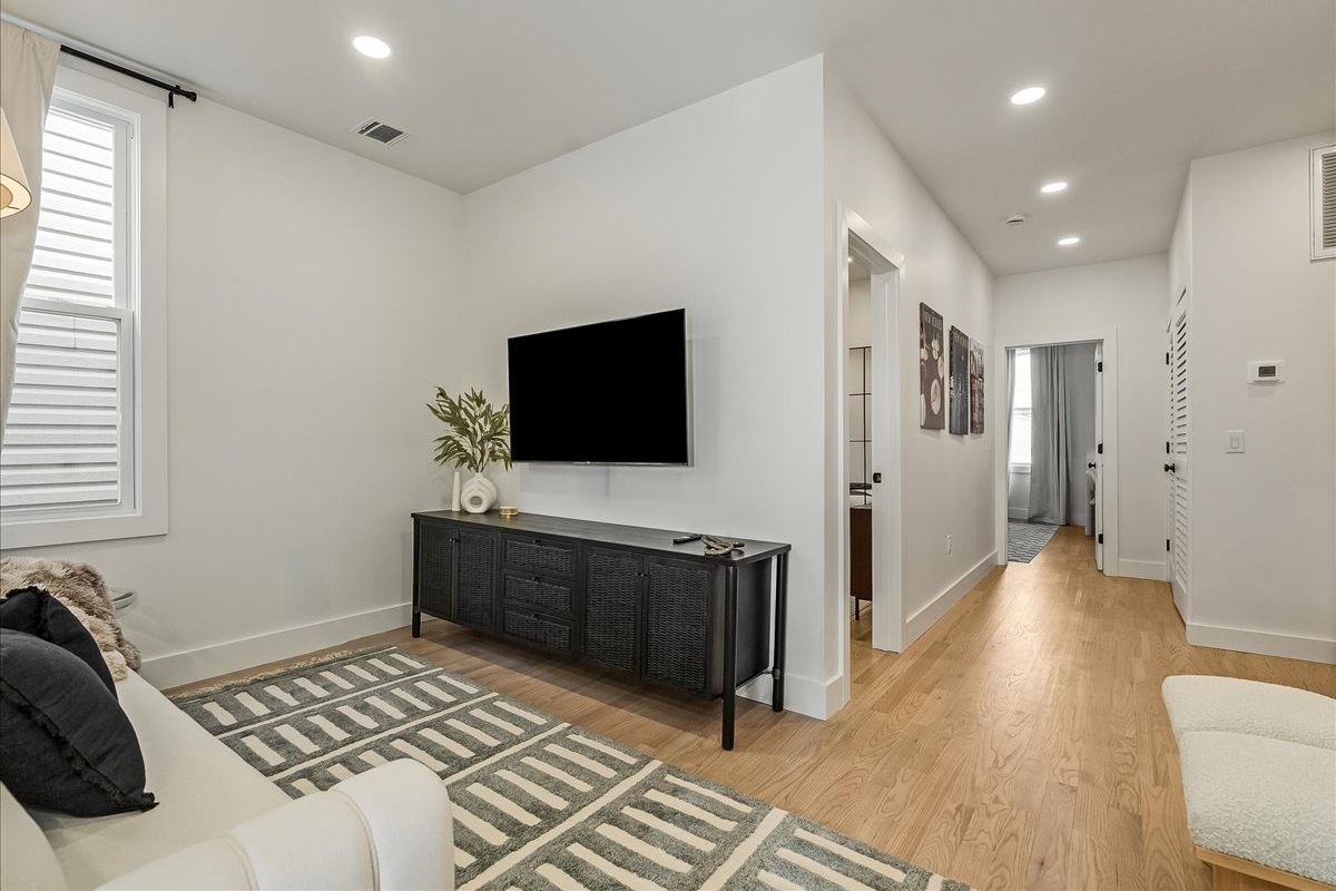 Modern flatscreen TV for luxurious movie nights.