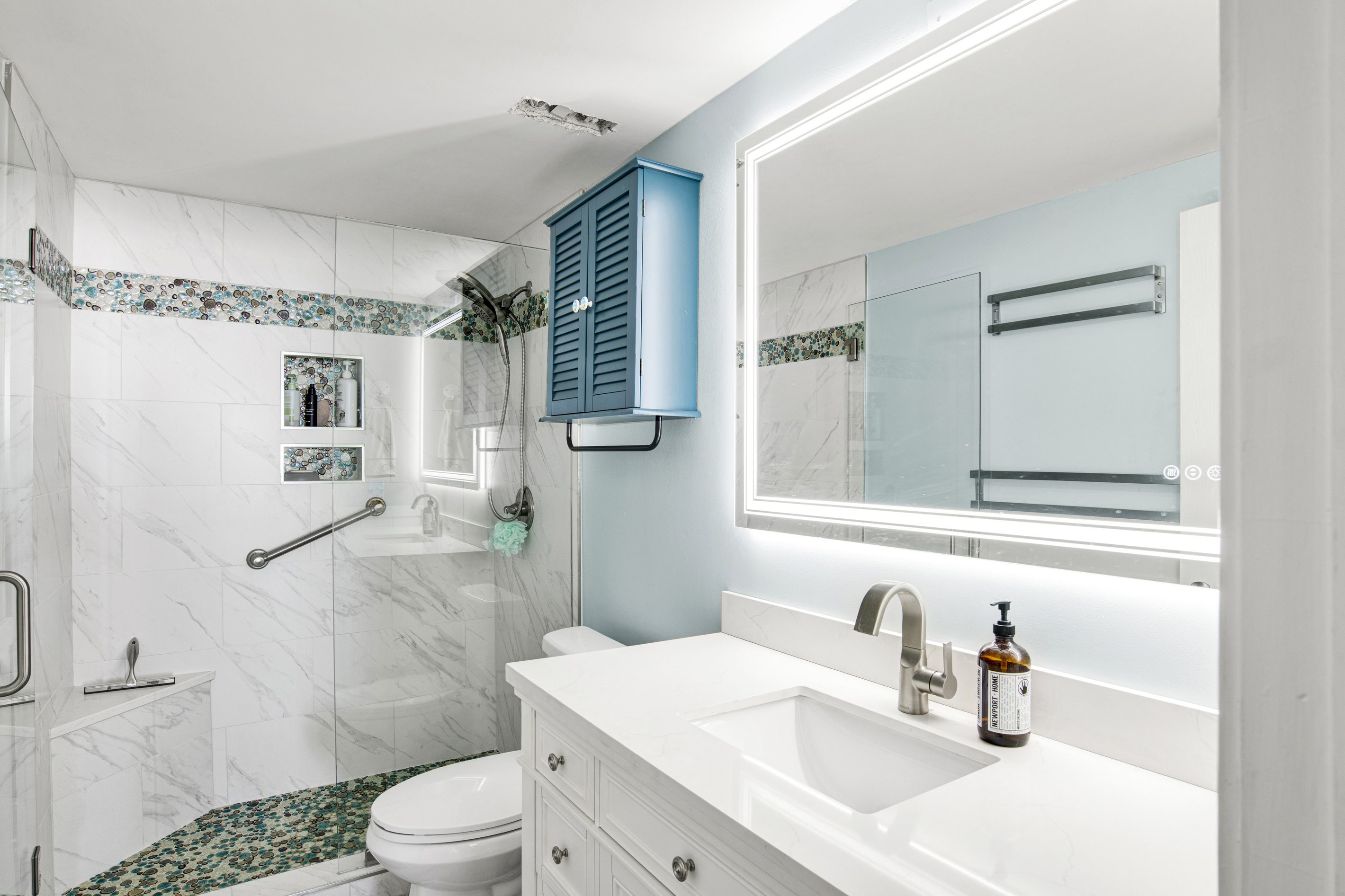 Recently updated ensuite primary bathroom - tile shower and glass doors