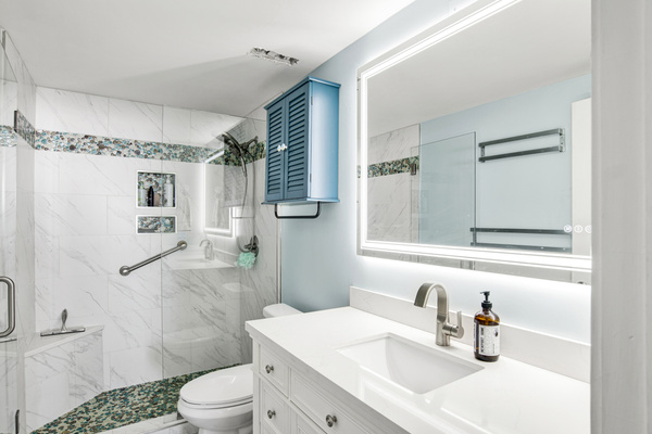 Recently updated ensuite primary bathroom - tile shower and glass doors